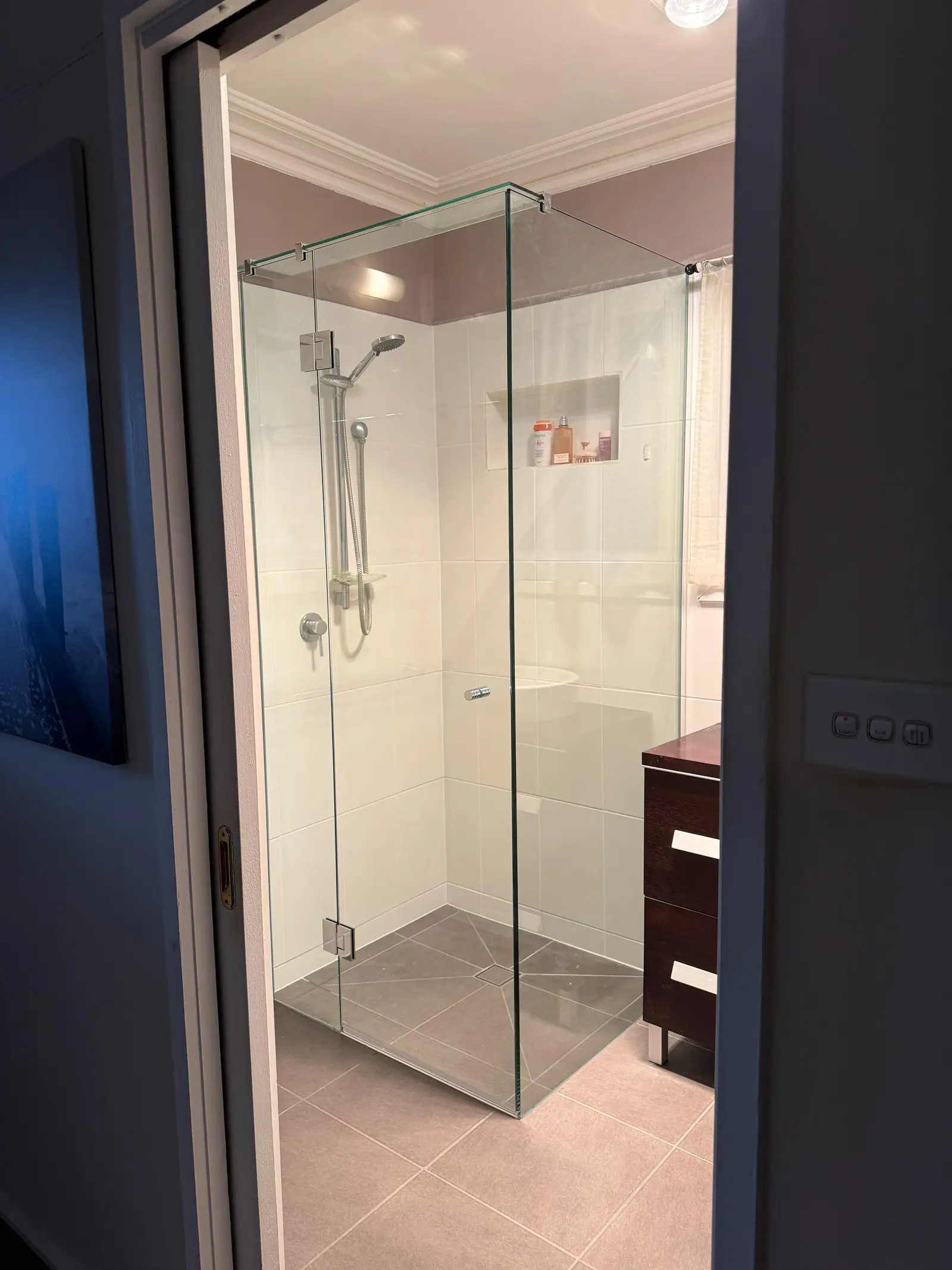 Completed shower with a newly tiled base and even fall to the floor waste